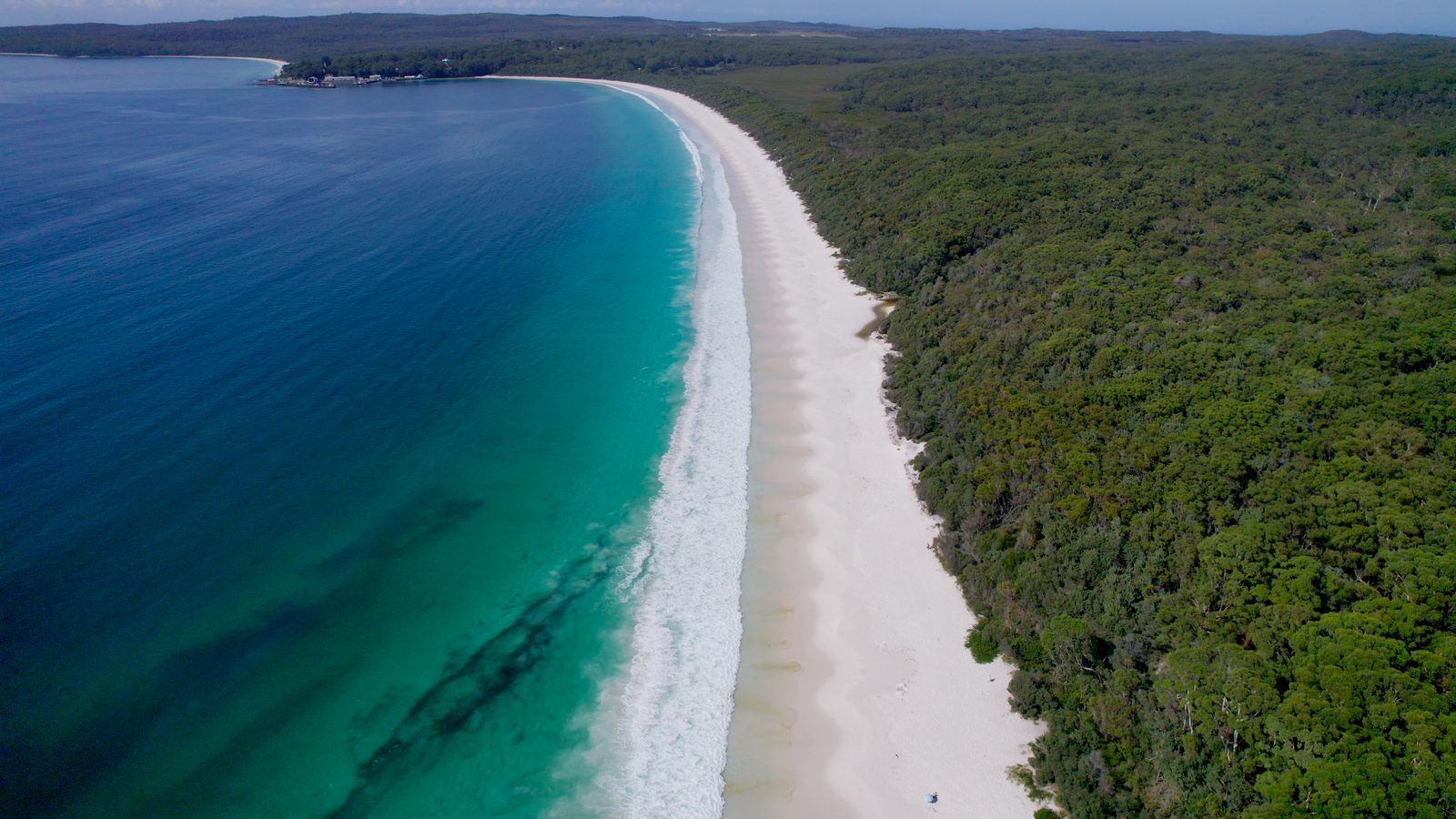 Aerial view of Hyams Beach, Shoalhaven, with white sand, turquoise water and bushland